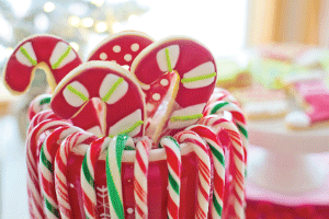 candy canes and cookies in a jar