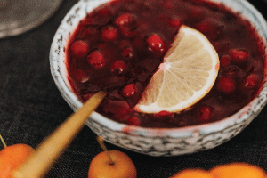 cranberry sauce in bowl with lemon slice