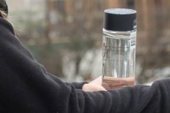 Student holding water bottle