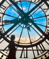 Girl by clock at Orsay Museum