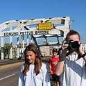 student with camera on Edmund Pettus Bridge
