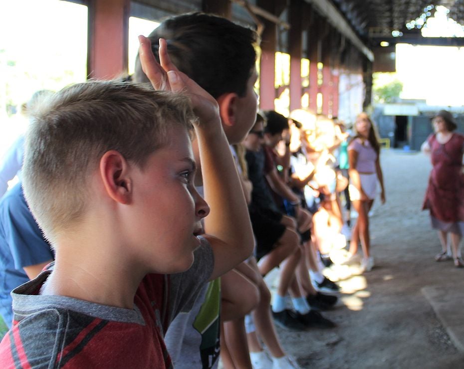 boy raising hand at Sloss Furnaces