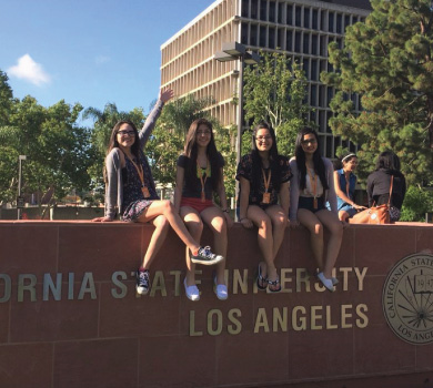 Girls at Cal State LA Sign